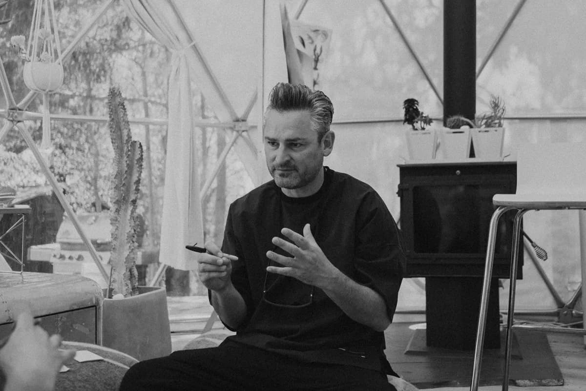 Dr. Frederik G. Pferdt mid-thought in a design studio